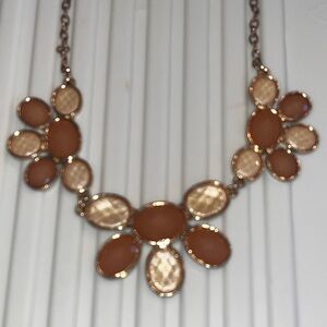 Beautiful beige tones, pendant,       paw-like necklace.